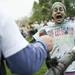A leaf blower is used on a Color Run participant on Saturday, May 11. Daniel Brenner I AnnArbor.com